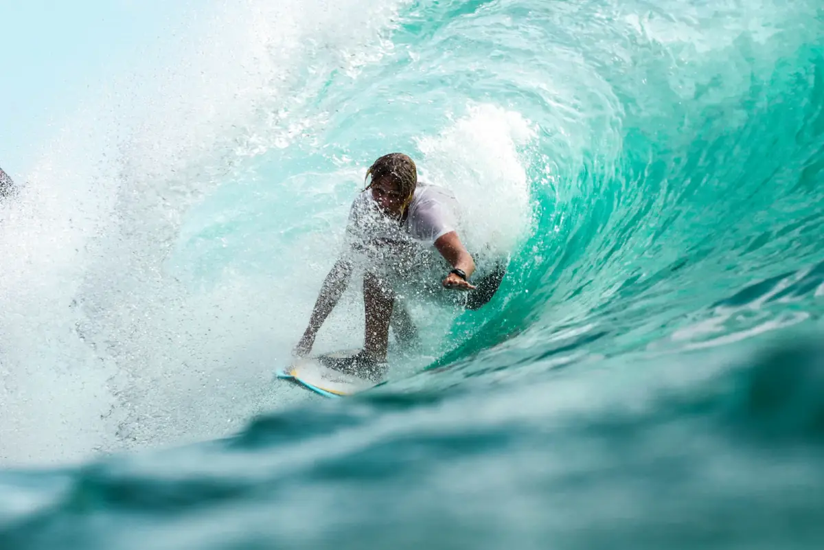Surfer riding a barrel wave in Bali